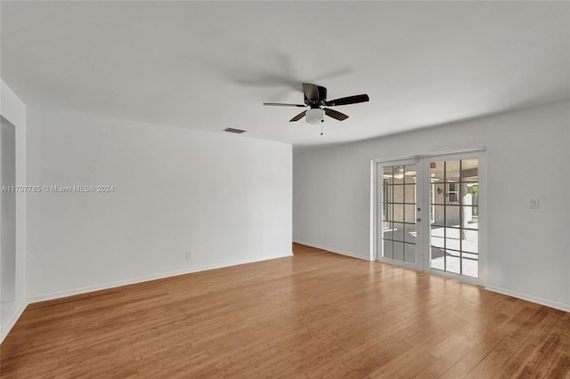 unfurnished room with ceiling fan, french doors, and light hardwood / wood-style floors