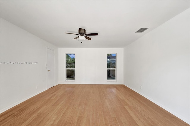 unfurnished room featuring ceiling fan and light wood-type flooring