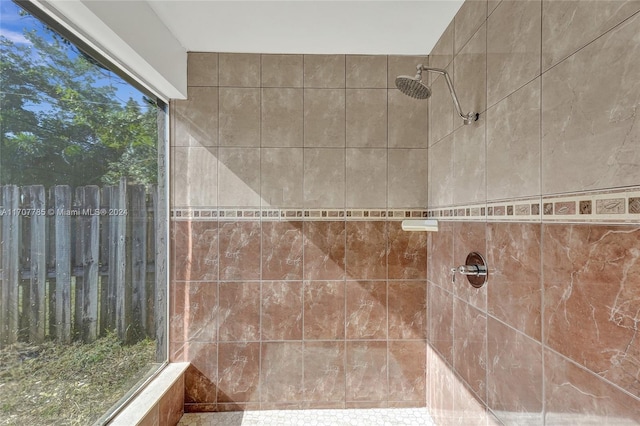 bathroom with a tile shower