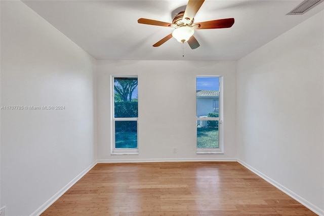 empty room with light hardwood / wood-style floors and ceiling fan