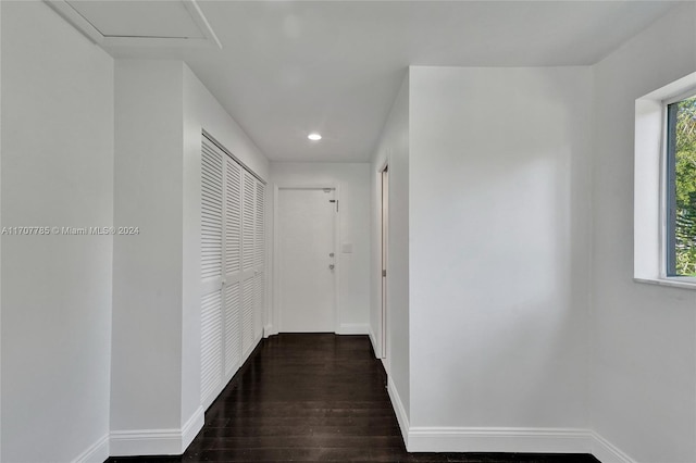 corridor with dark wood-type flooring