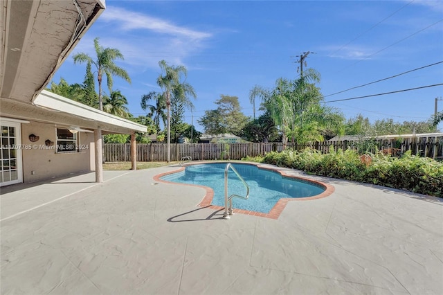 view of swimming pool with a patio area