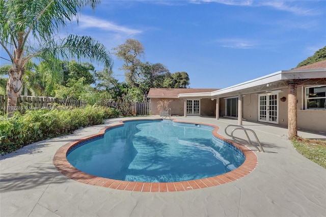 view of pool featuring french doors and a patio