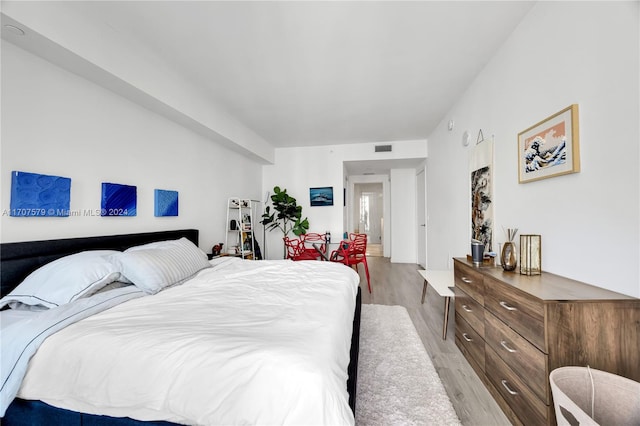 bedroom with light hardwood / wood-style floors