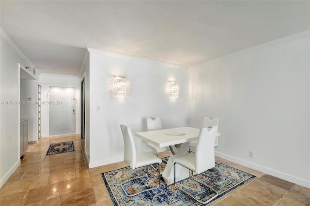 dining room featuring crown molding