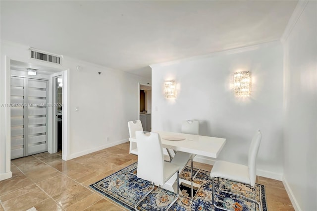 dining room featuring ornamental molding