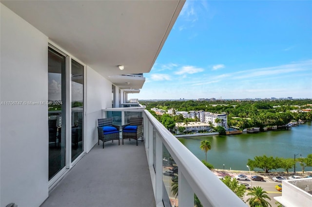 balcony featuring a water view