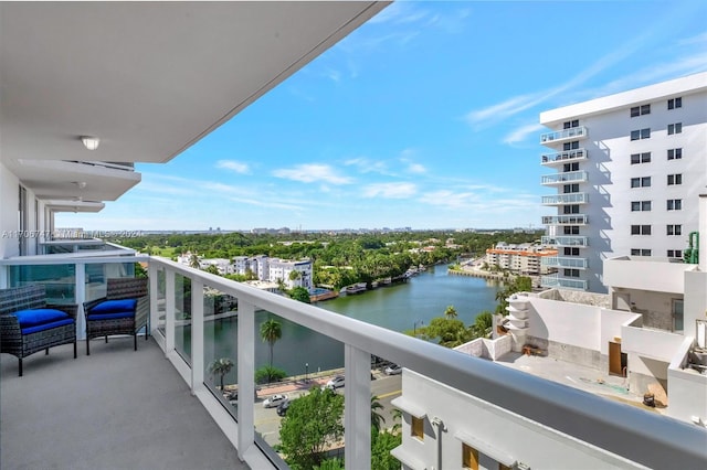 balcony featuring a water view