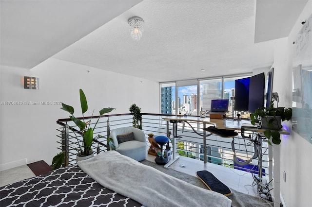 living room featuring floor to ceiling windows, a textured ceiling, and plenty of natural light