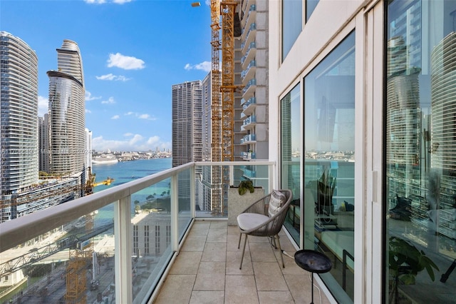 balcony featuring a water view