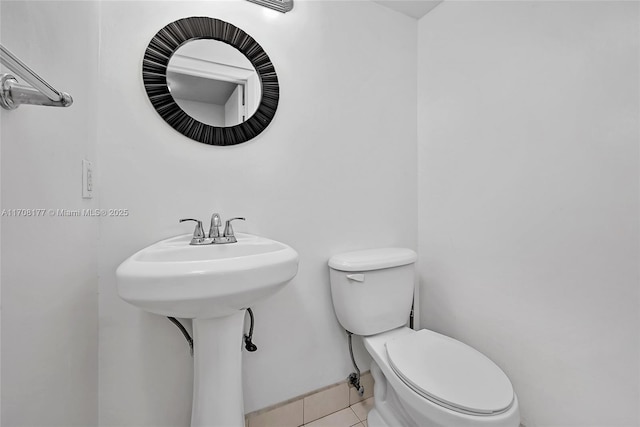 bathroom featuring tile patterned floors and toilet