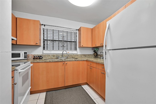 kitchen featuring sink, white appliances, light tile patterned flooring, and light stone counters