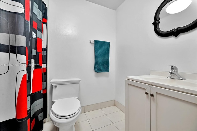 bathroom featuring toilet, tile patterned flooring, and vanity