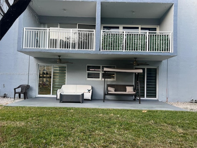 back of property featuring an outdoor hangout area, a balcony, and a patio area