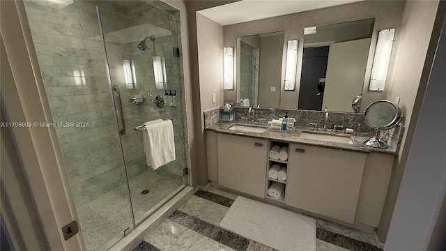 bathroom featuring vanity and an enclosed shower