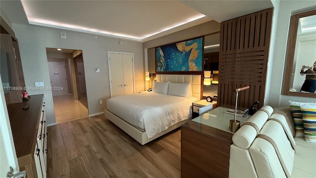 bedroom featuring hardwood / wood-style flooring and a closet