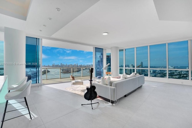 100 S Pointe Dr Unit 3601, Miami Beach, FL 33139 - living room with floor to ceiling windows, a city view, a water view, and healthy amount of natural light