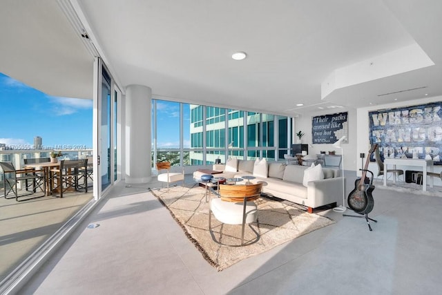 100 S Pointe Dr Unit 3601, Miami Beach, FL 33139 - living area featuring expansive windows and concrete floors