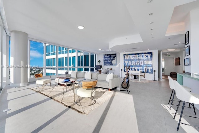 living room featuring a wall of windows