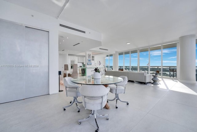 dining area featuring floor to ceiling windows