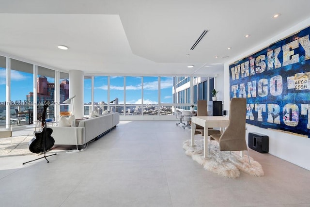 100 S Pointe Dr Unit 3601, Miami Beach, FL 33139 - living room with expansive windows, finished concrete flooring, and recessed lighting