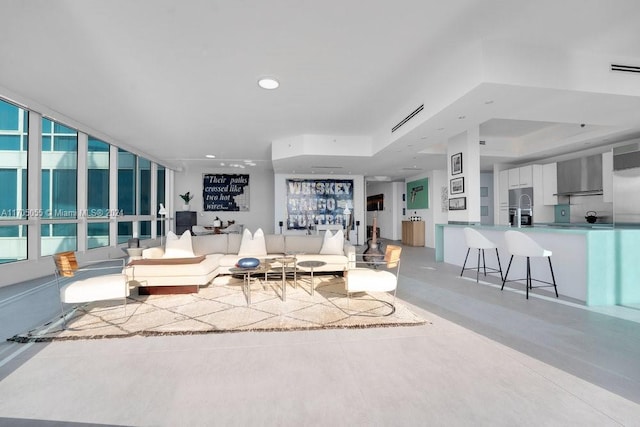 living room featuring a tray ceiling