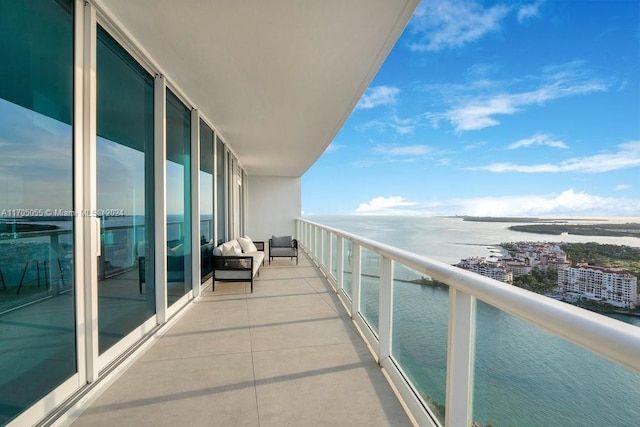 balcony featuring a water view