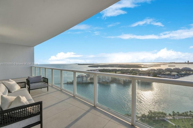 balcony featuring a water view