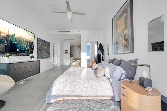 100 S Pointe Dr Unit 3601, Miami Beach, FL 33139 - bedroom featuring ceiling fan and ensuite bath