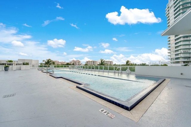 view of pool featuring a patio area