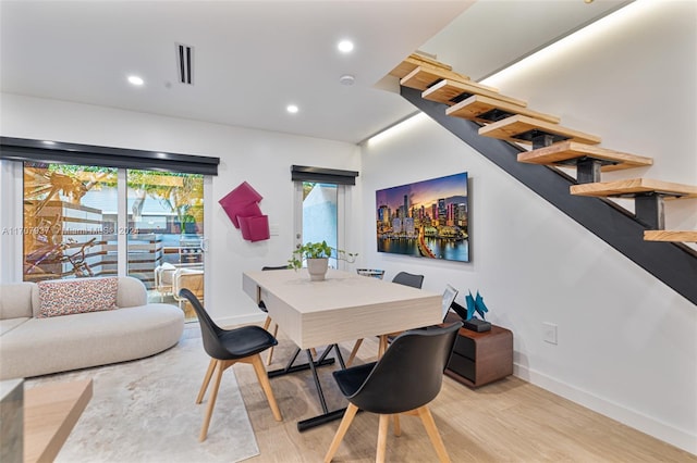 dining area with light hardwood / wood-style floors