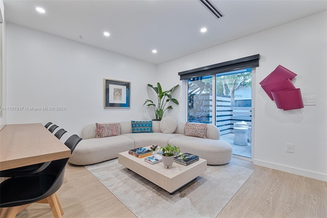 living room with light hardwood / wood-style floors