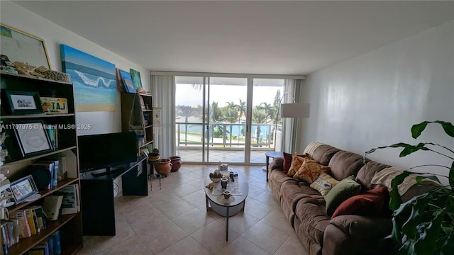 tiled living room with floor to ceiling windows