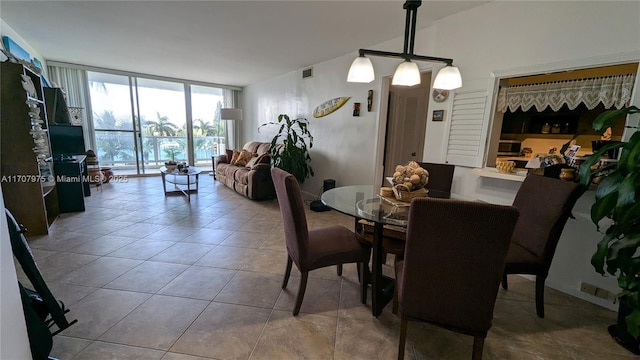 dining room with a wall of windows