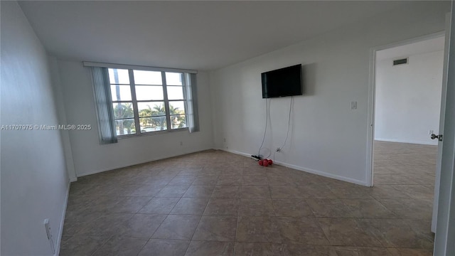 view of tiled spare room