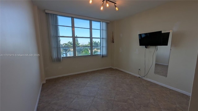 empty room with an inviting chandelier