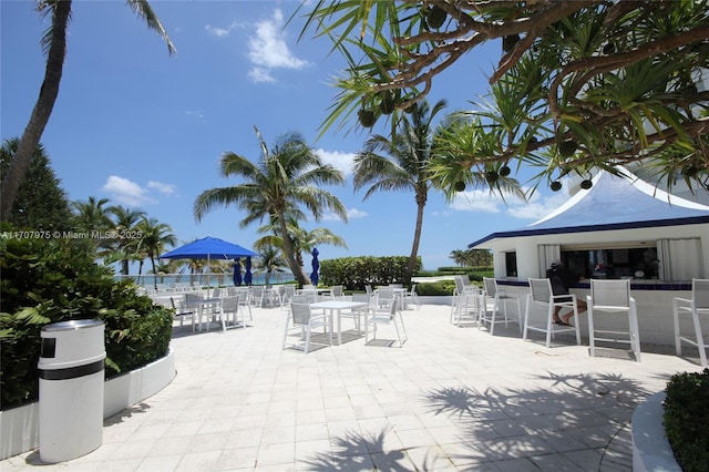 view of patio featuring an outdoor bar