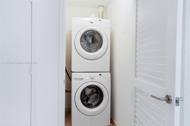 laundry area with stacked washer and dryer