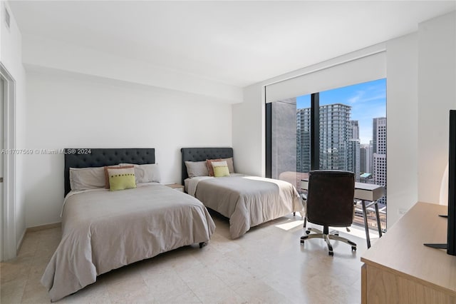 bedroom with a wall of windows