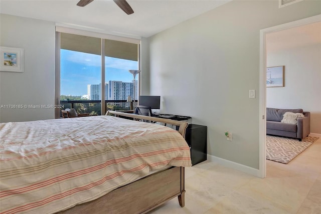 bedroom with floor to ceiling windows, access to outside, and ceiling fan