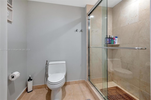 bathroom with walk in shower, tile patterned floors, and toilet