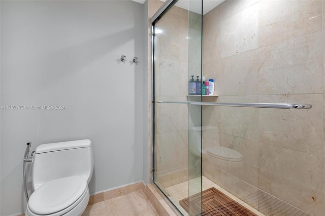 bathroom with tile patterned flooring, toilet, and walk in shower