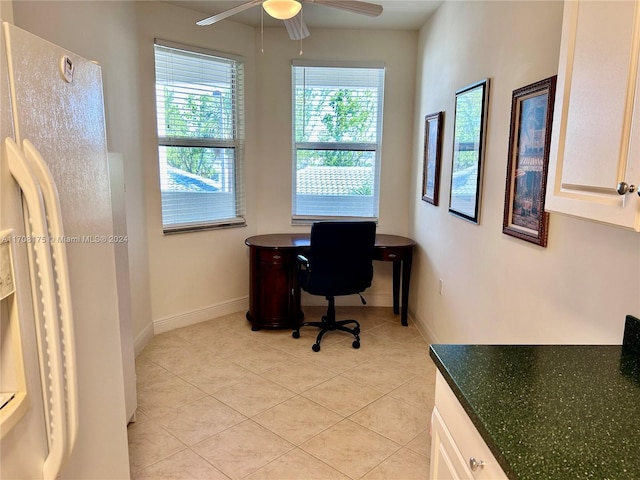 office space with ceiling fan and light tile patterned floors