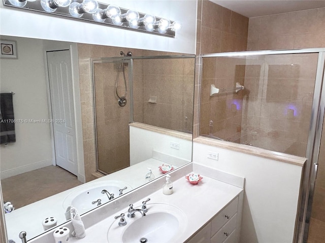 bathroom featuring vanity and a shower with door