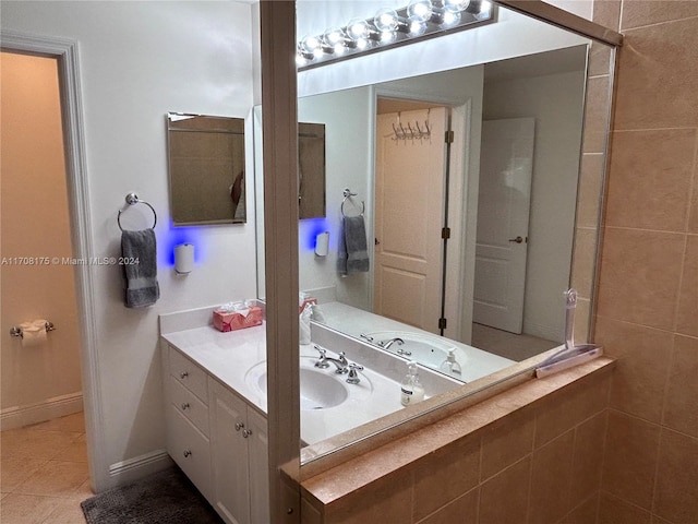 bathroom with tile patterned flooring and vanity