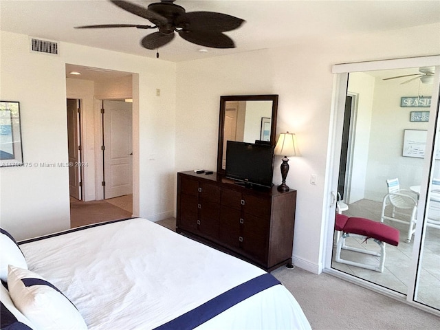 bedroom with a closet, light colored carpet, and ceiling fan