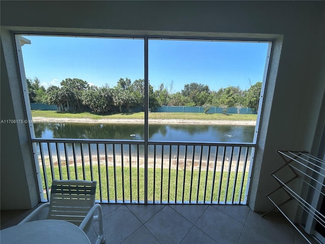 unfurnished sunroom with a water view