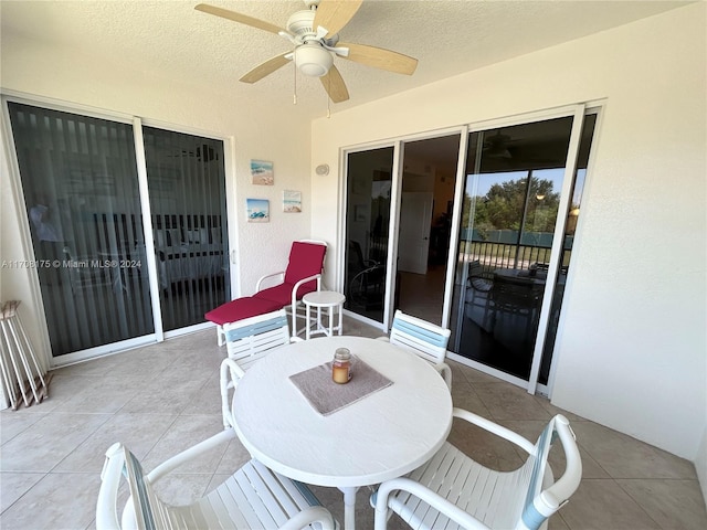 view of patio featuring ceiling fan