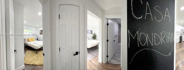 corridor featuring wood-type flooring