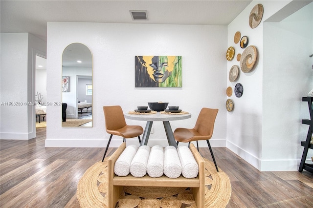 dining area with dark wood-type flooring